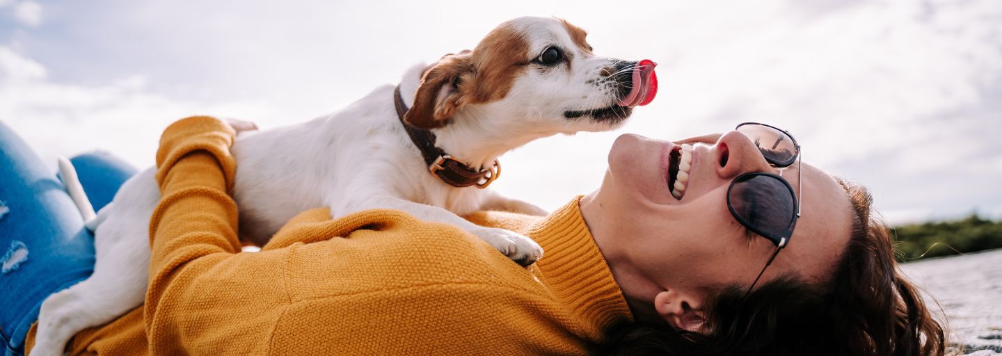 Dog trying to lick owner's face